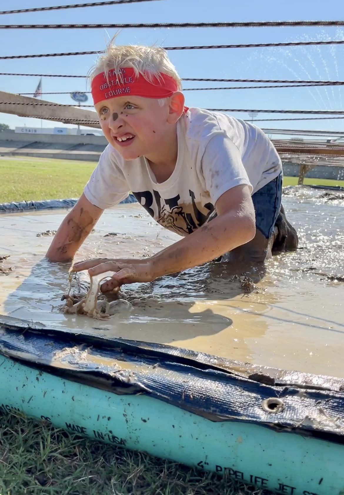 Kid in mud pit